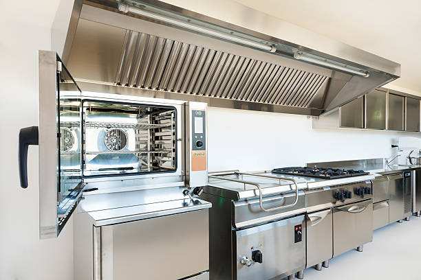 Professional kitchen made from stainless steel appliances stock photo