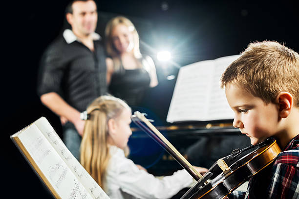 istock Proud parents with their children. 471712579