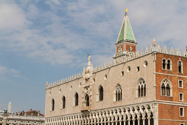 Venice, Italy - January 12th, 2012: A boat passing in early morning by the Palazzo Ducale di Venezia, one of the most famous buildings in Venice, San marco.