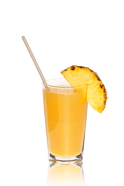 istock Mirrored glass of pineapple juice with drinking straw 471713517