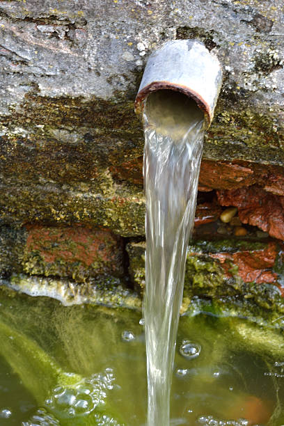 istock Small pipe of water in garden 471715255