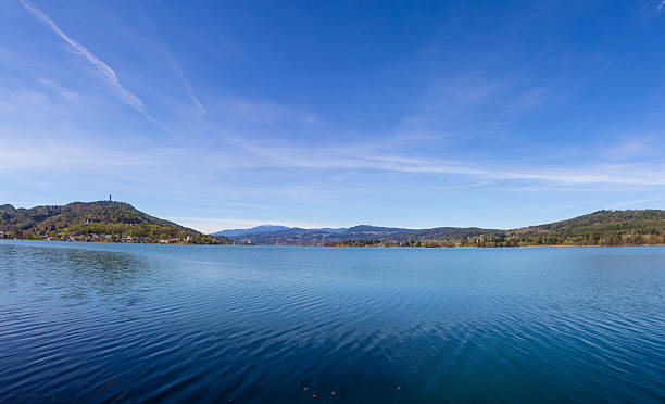Lake Woerth View To Maria Woerth & Pyramidenkogel Panorama Taken on April 15th, 2015 during a break at university on a warm and sunny day in spring. Decided to use a few hours to enjoy the afternoon at the southside of Lake Woerth! maria woerth stock pictures, royalty-free photos & images