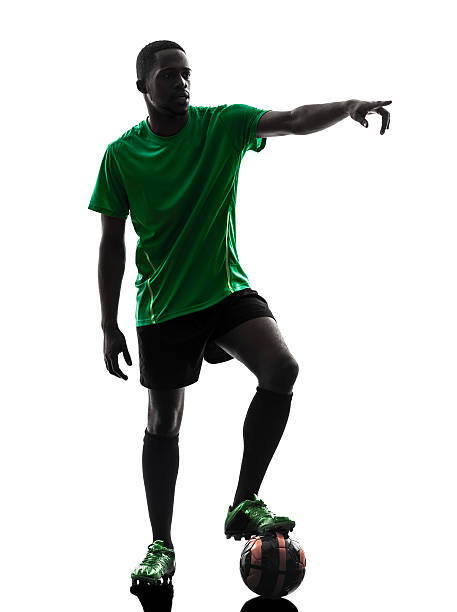istock african man soccer player  free kick silhouette 471716211