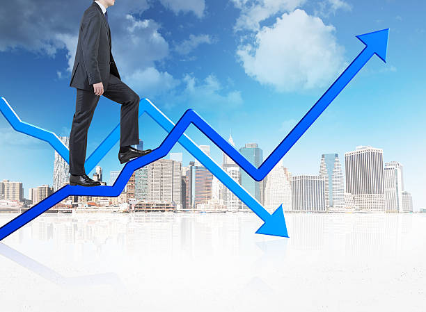 istock businessman walking on charts 471716490