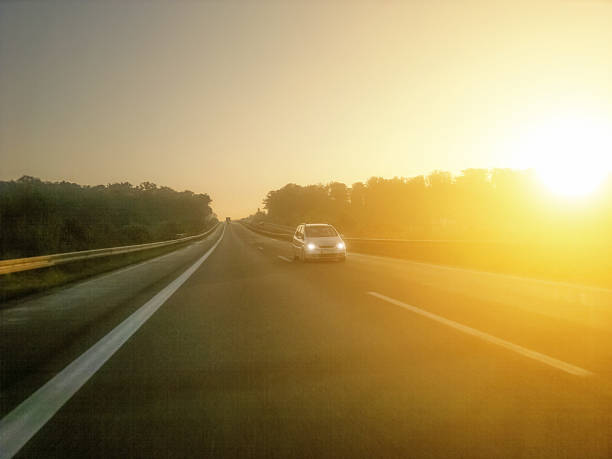 istock car in morning light on highway 471718275