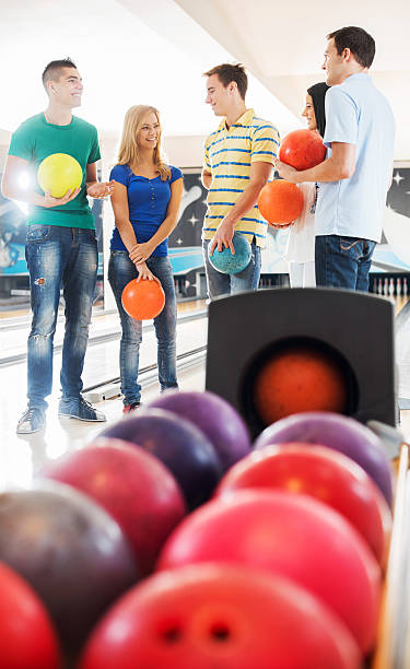 istock Friends communicating at bowling alley. 471718589