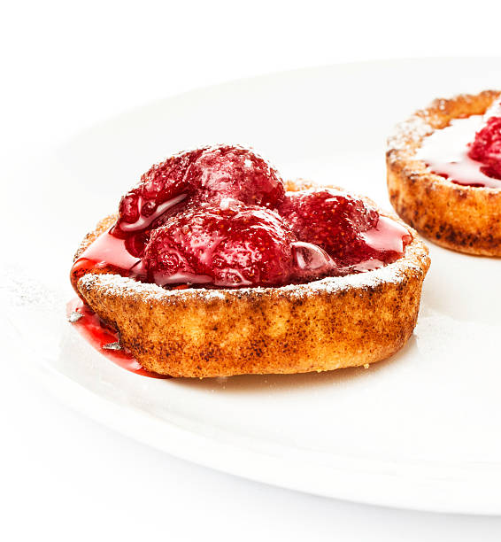 istock Dessert fruit cake with strawberry on a white plate isolated 471719283