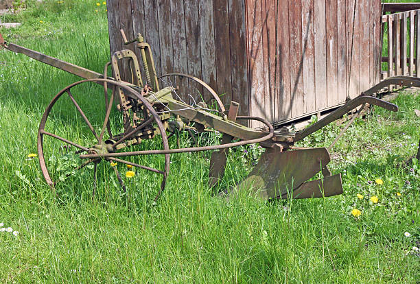 istock old rusty plow to work the land in Meadow Green 471720409