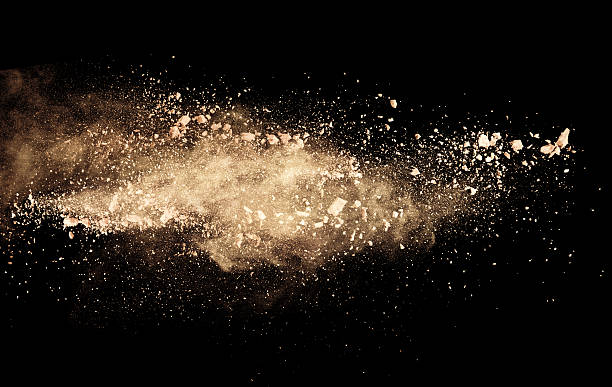 istock White dust flying through the air on a black background 471720427