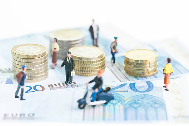 Miniature people on Euro banknotes and coins