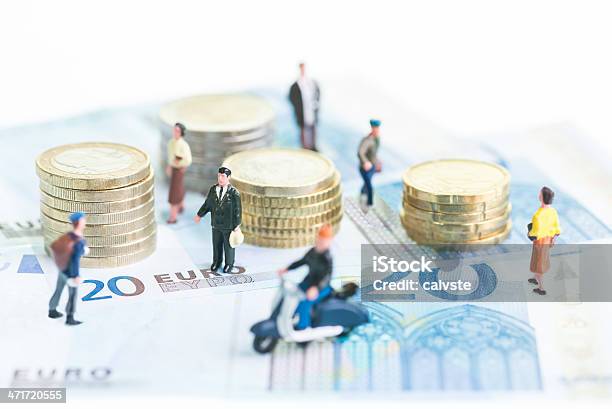 Miniature People On Euro Banknotes And Coins Stock Photo - Download Image Now - European Union Currency, Wages, People
