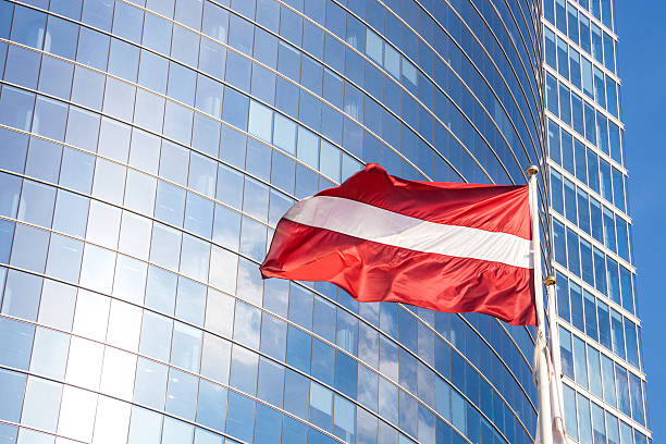 istock Latvia flag against glass skyscraper 471721105