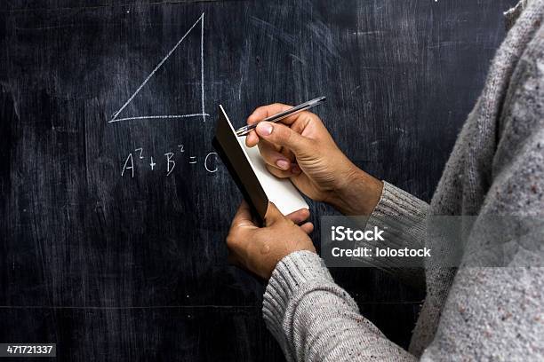 Man Taking Notes Of Math Theorem On Blackboard Stock Photo - Download Image Now - Pythagoras, Chalkboard - Visual Aid, Holding