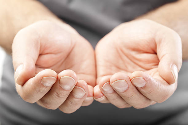 istock two male hands as if giving, showing or holding concept 471723093