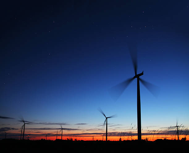 istock Windmills at Sunset with Stars 471724283