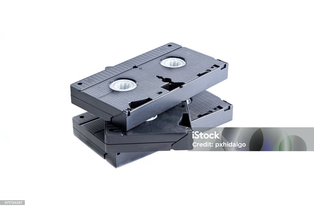 Pila di videocassette su sfondo bianco. - Foto stock royalty-free di Attrezzatura