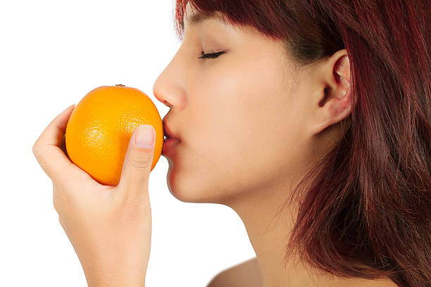 istock Young asian woman with an orange 471726043