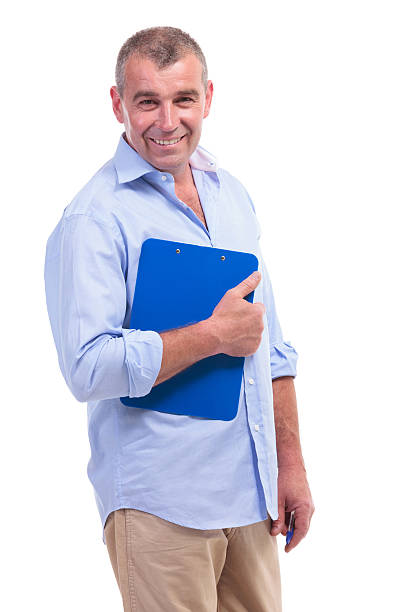 istock casual middle aged man with clipboard 471726119