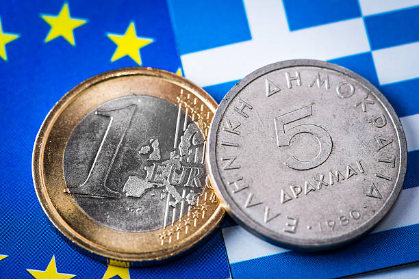 istock Euro and Drachma coins on Greek and EU flags 471726826