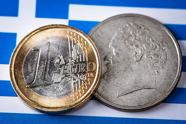 istock Euro and Drachma coins on Greek and EU flags 471726836
