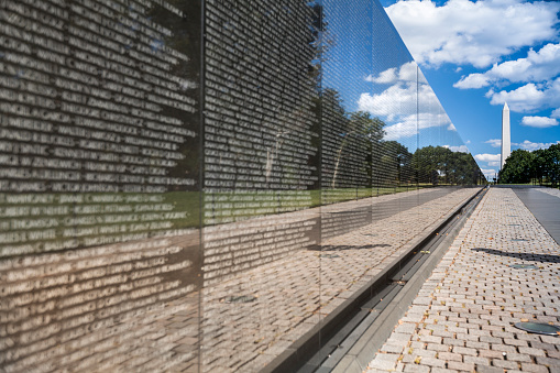 Washington D.C., USA - September 23, 2012: Vietnam Veterans War Memorial with the Washington Monument on the National Mall.