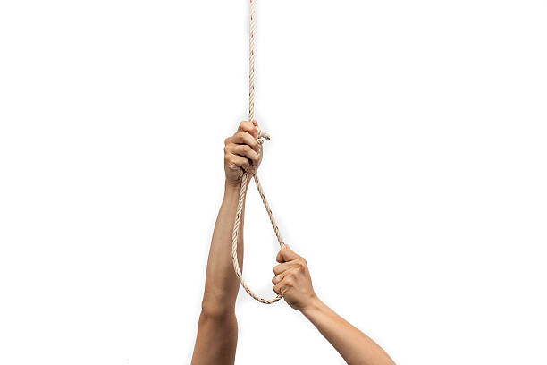 istock Hands holding rope slipknot in concept suicide isolated on white 471728876