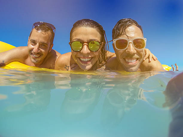 istock Friends together on the beach 471728999