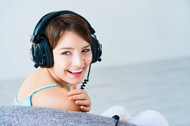 istock Young woman with headphones 471729439