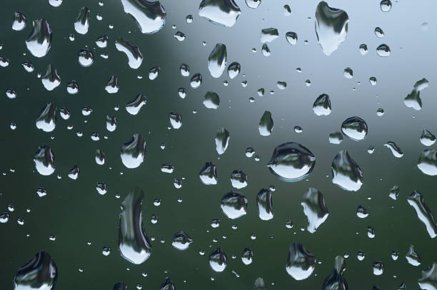 Close up of rain drops on a window stock photo