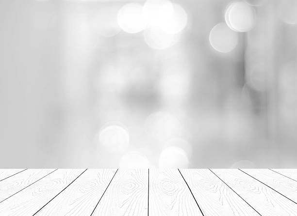 istock Perspective white wood and blurred store with bokeh background 471731424