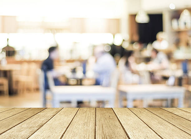 istock Perspective wood and blurred cafe with bokeh light background 471731440