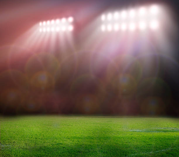 istock Out of focus lights in a grassy stadium 471731881