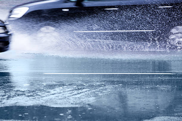 istock Cars on wet road 471732595