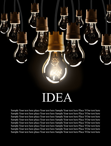 Light bulbs with single one shinning, isolated on black background