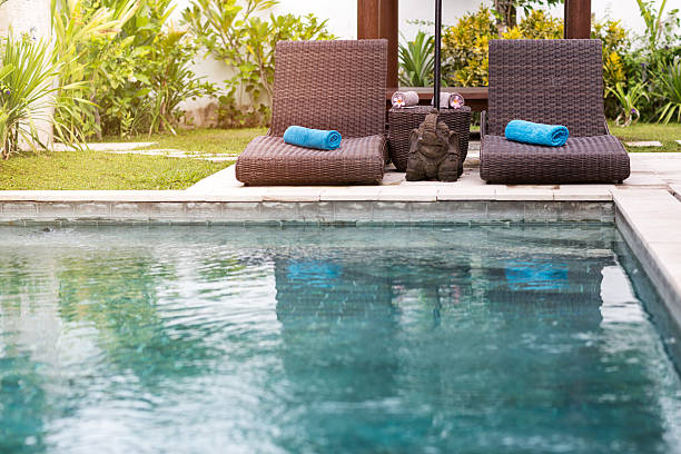istock Clear blue water in swimming pool and sunbeds 471733178