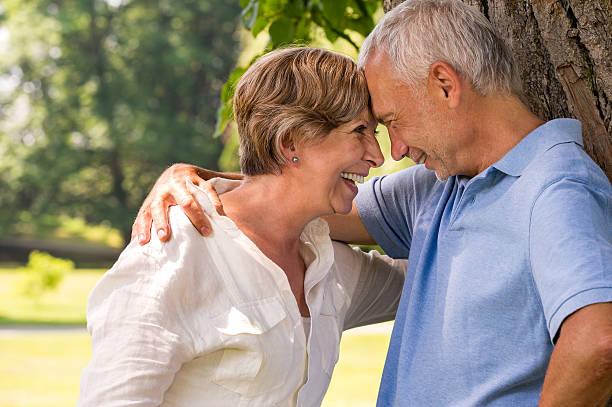 istock Elderly couple laughing outdoors 471733433