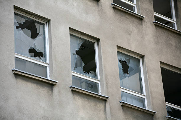 istock Broken windows in a vacant block of flats 471733903