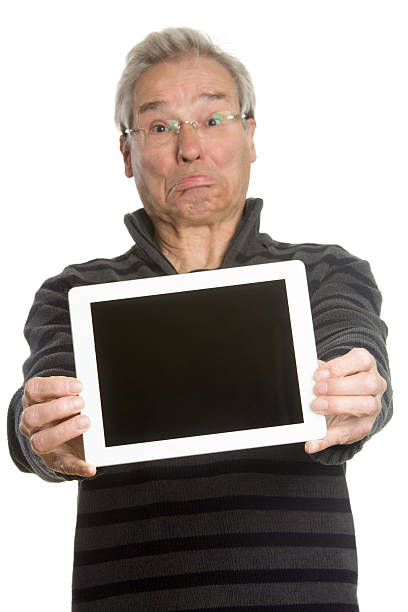 Senior Caucasian man portrait series, showing tablet computer stock photo