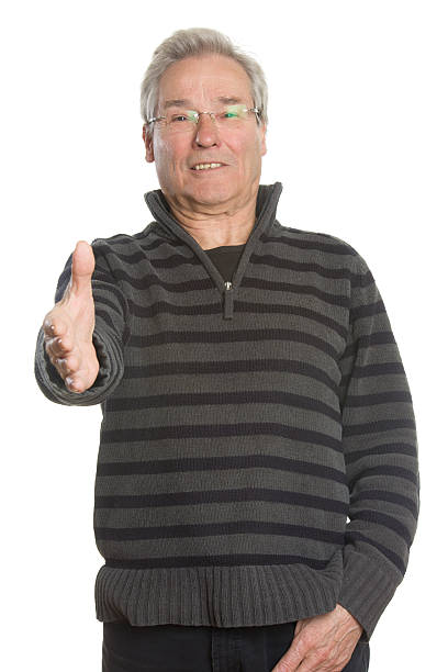 istock Senior Caucasian man portrait series offering handshake 471734225