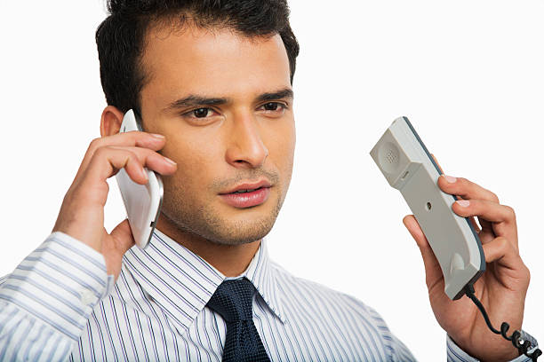 istock Businessman talking on phones 471734631