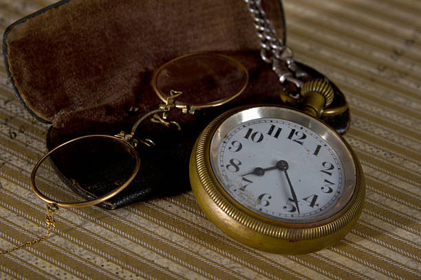 istock Pocket watch and glasses 471734703