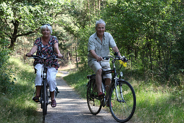 istock Senior Couple Cycling Together 471736079