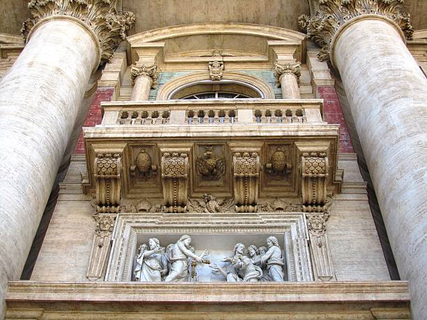 Details of St. Peter's Basilica - Basilica Papale di San Pietro in Vaticano, beautiful capital Rome in Italy under blue sky with white clouds, it is summer time for holidays and many tourists, there is a lot of history to experience the amphitheater, the ancient architecture of the Arena, the famous Colosseum, the historic Roman Forum, the spanning staircase and the Trevi Fountain are attractions and a sight of ancient culture and ornate art,  the river Tiber ItalianTevere is the pride of every Roman, the Catholic Church shows itself in Rome with St. Peter's Basilica, Roman ancient basilica, basilica papale di san pietro in vaticano, the castel sant'angelo, the cathedral church, valuable history and heritage of the people, dome characterize the urban landscape of Rome