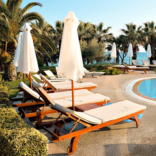 istock Beautiful lounges near the pool 471737357