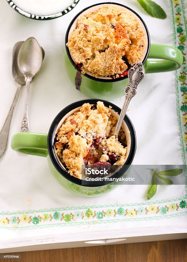 Fruit crumble topping cupcakes Fruit crumble topping cupcakes in green cups 2015 Stock Photo