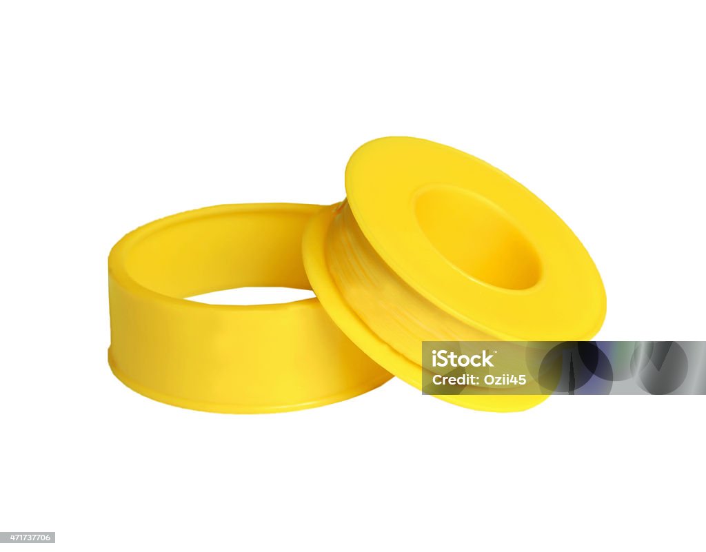 tape FUM Rezbouplotnitelnaya FUM tape of yellow color on a white background 2015 Stock Photo