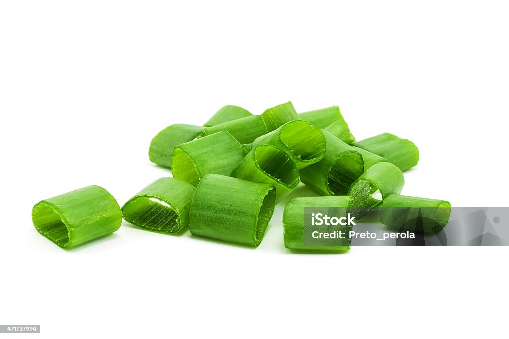 A small pile of chopped green onions chopped green onions on white Scallion Stock Photo