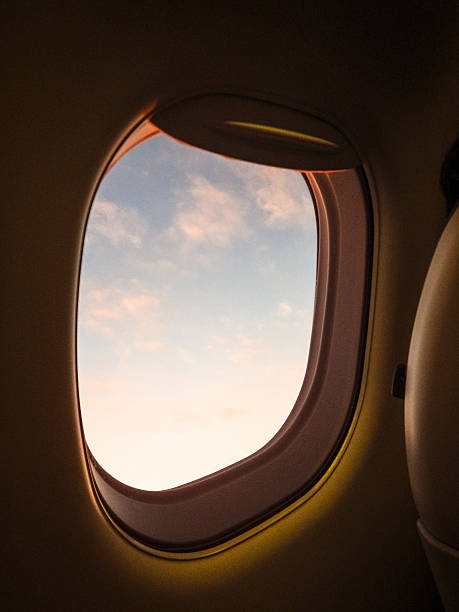istock Sunlight from the porthole on airplane 471738174