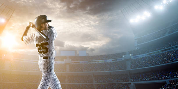 Baseball player hitting a ball in stadium