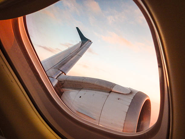 istock Sunlight from the porthole on airplane 471740156